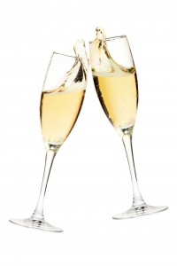 Cheers! Two champagne glasses. Isolated on white
